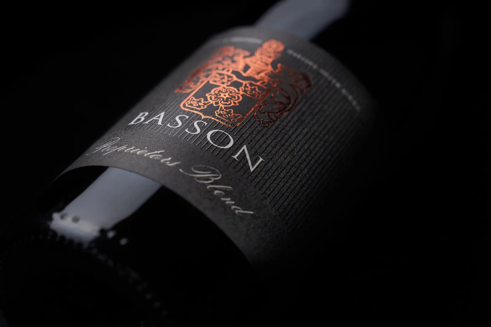 A close-up of the Ormonde Wines Basson bottle and copper label